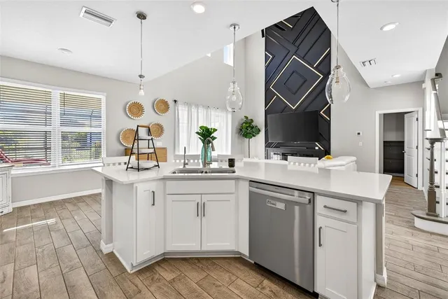 a kitchen with a sink stove and cabinets