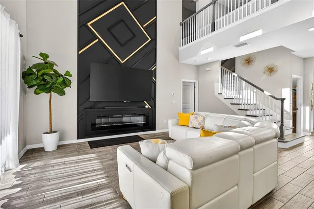 a living room with a couch and a fireplace