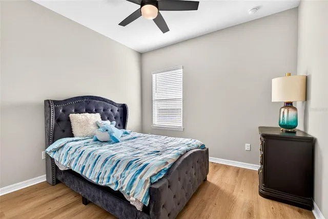 a bedroom with a bed and a cabinets