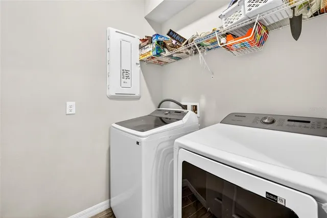 a front view of a house with a yard table and chairs