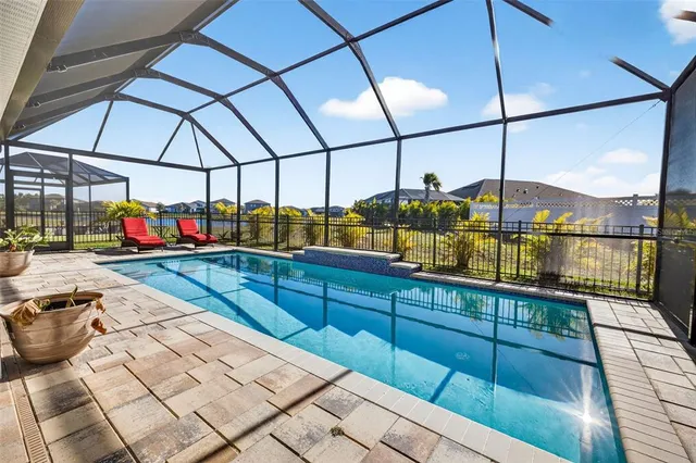a living room with furniture a chandelier and a chandelier