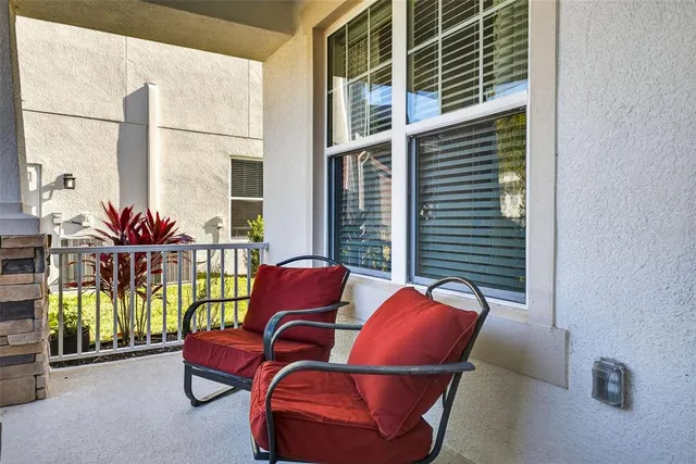 a outdoor living space with furniture and a potted plant