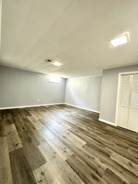 513 Cookane Avenue Elgin, IL 60120 - Photo 19 of 26 an empty room with wooden floor and windows