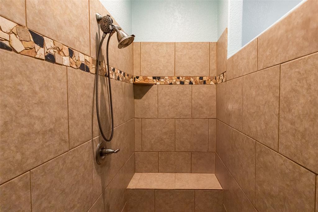 1775 Sunset Mountain Road Lipan, TX 76462 - Photo 15 of 34 a bathroom with a shower