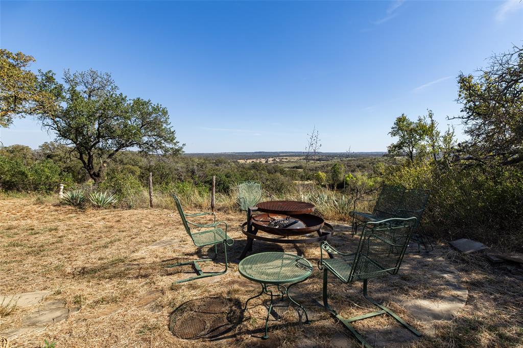 1775 Sunset Mountain Road Lipan, TX 76462 - Photo 29 of 34 a view of an outdoor space and seating area