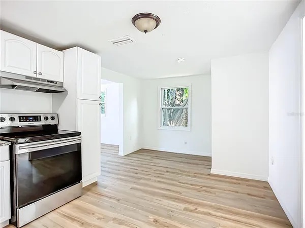 a kitchen with a stove and a microwave