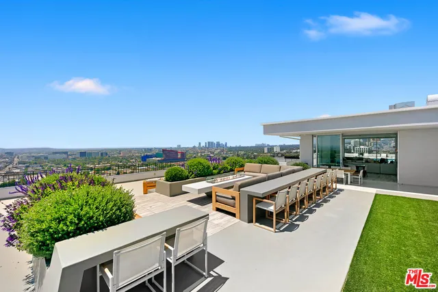 a view of a chairs and table in a patio