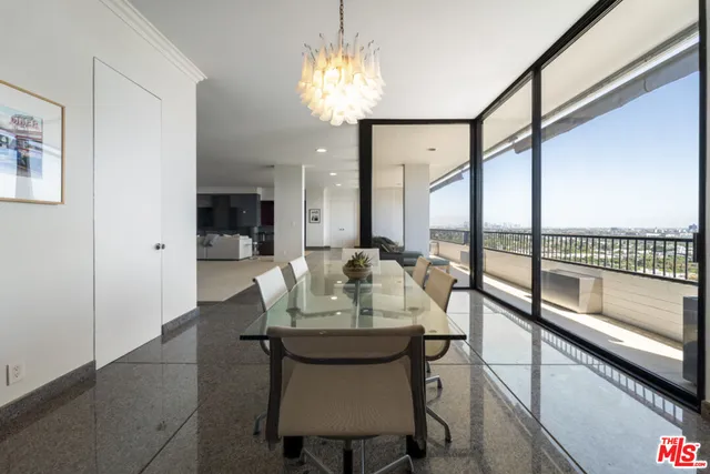 a balcony with furniture and view