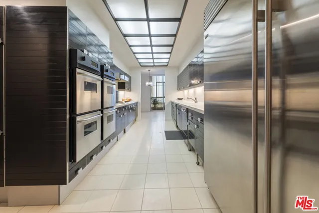 a large kitchen with stainless steel appliances and lots of counter space