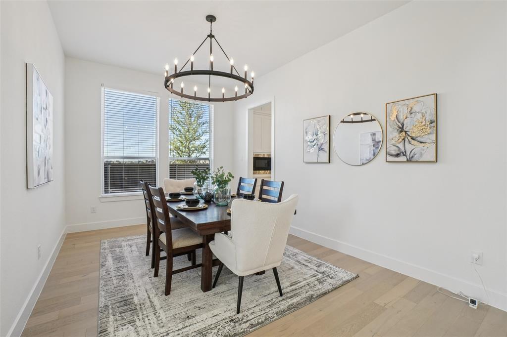 2800 Count Fleet Way Celina, TX 75009 - Photo 12 of 34 a view of a dining room with furniture window and wooden floor