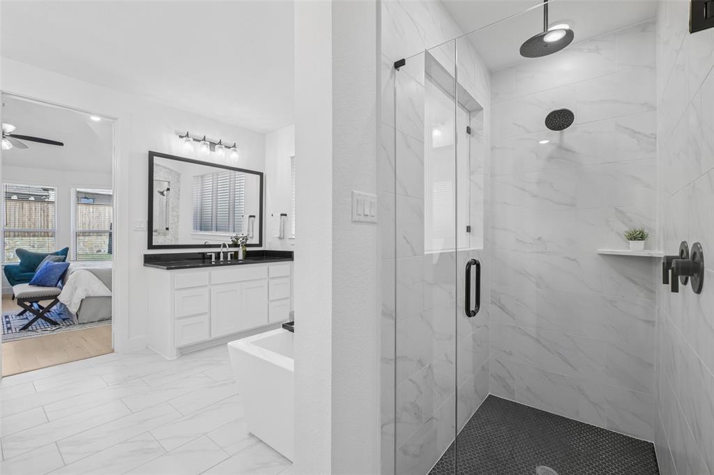 2800 Count Fleet Way Celina, TX 75009 - Photo 25 of 34 a bathroom with a double vanity sink a mirror and a shower