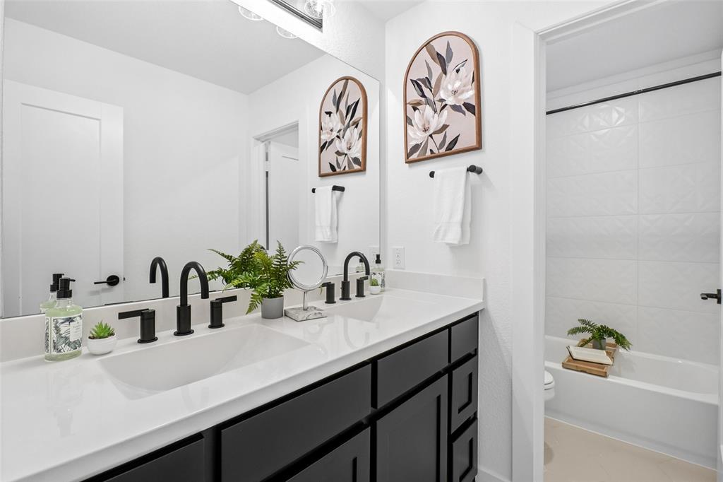 2800 Count Fleet Way Celina, TX 75009 - Photo 7 of 34 a bathroom with a sink and a mirror