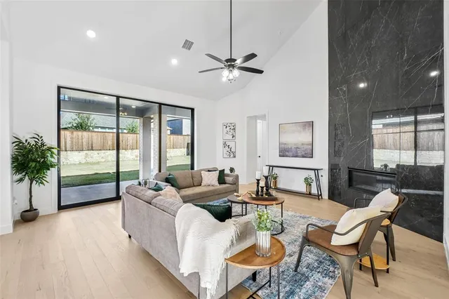 a living room with furniture and a large window