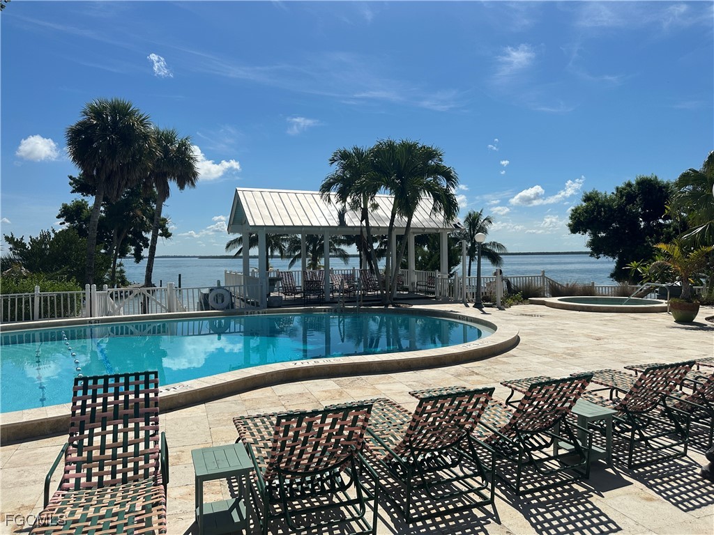 327 Useppa Island Bokeelia, FL 33922 - Photo 13 of 13 a view of a swimming pool with a patio