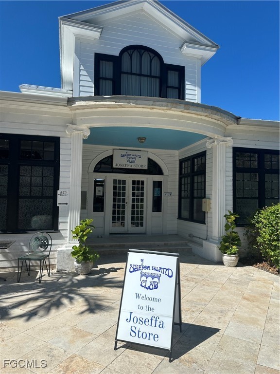 327 Useppa Island Bokeelia, FL 33922 - Photo 10 of 13 a front view of a house with garden
