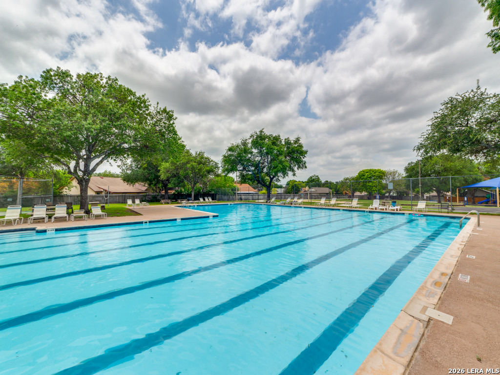 3439 Ridge Ranch San Antonio, TX 78247 - Photo 23 of 25 a view of yard with swimming pool and trees in the background