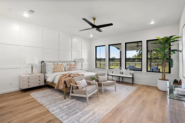 a bed room with a bed and a chair