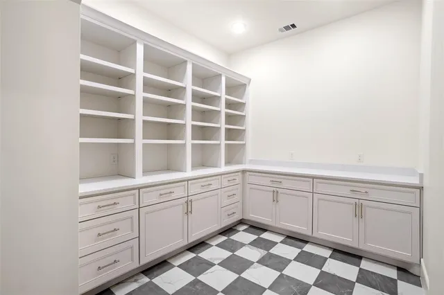 a kitchen with a cabinets and a window