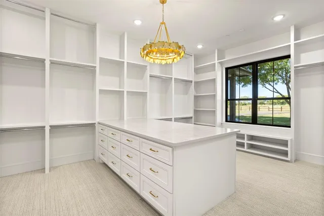 a kitchen with a refrigerator and windows