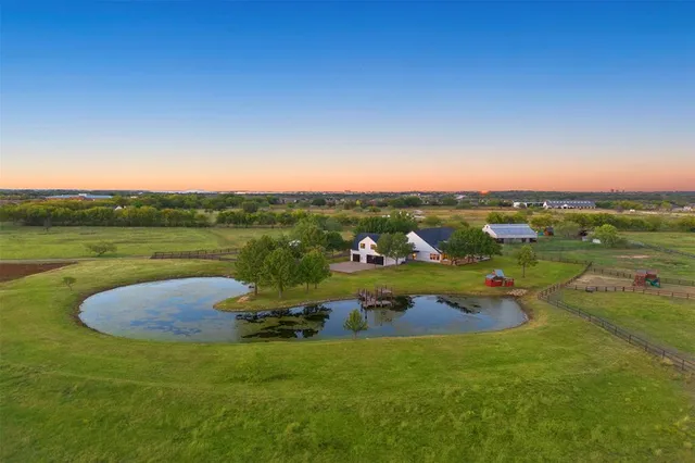 an aerial view of a house with outdoor space