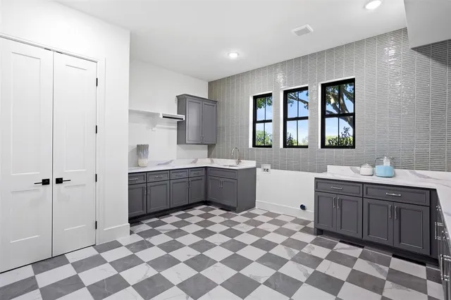 a large bathroom with a sink mirror and a bathtub