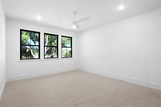 a bathroom with a toilet a sink a mirror and shower