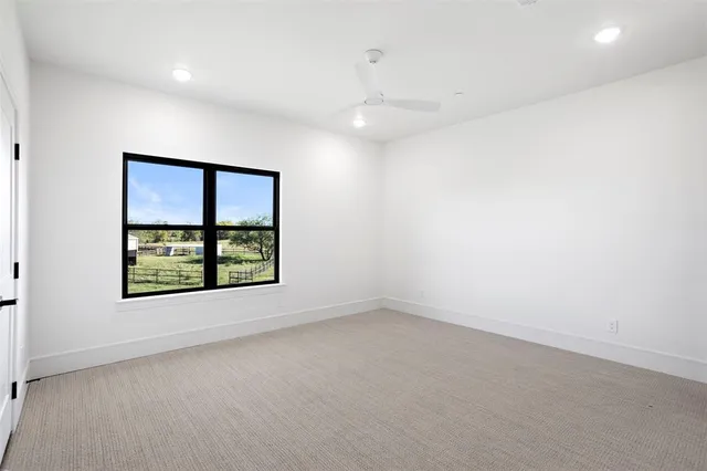 a front view of a house with a big yard