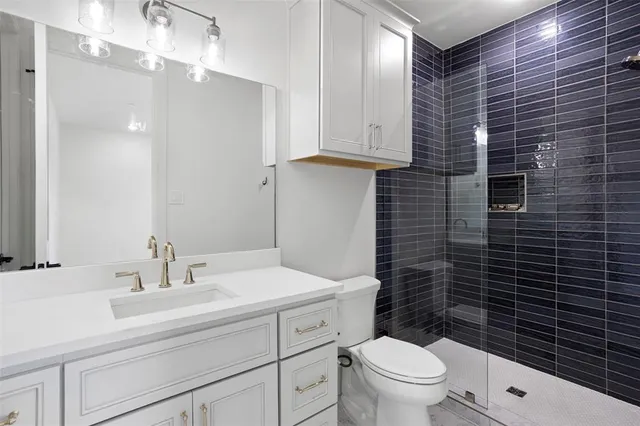 an empty room with a window and a ceiling fan