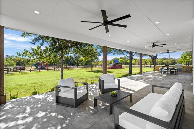 a outdoor dining space with furniture and outdoor view