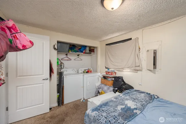 a bedroom with a bed and cabinets
