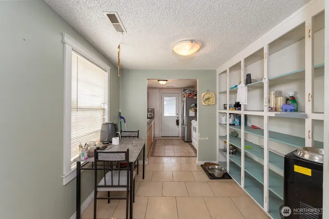 a room with furniture a rug and a window