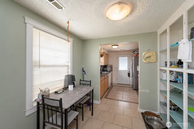 a view of a kitchen with furniture and window