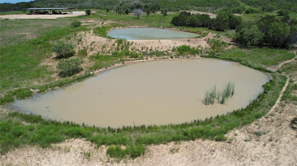 464 Upper Brad Road Strawn, TX 76475 - Photo 31 of 32 Drone / aerial view featuring a water view