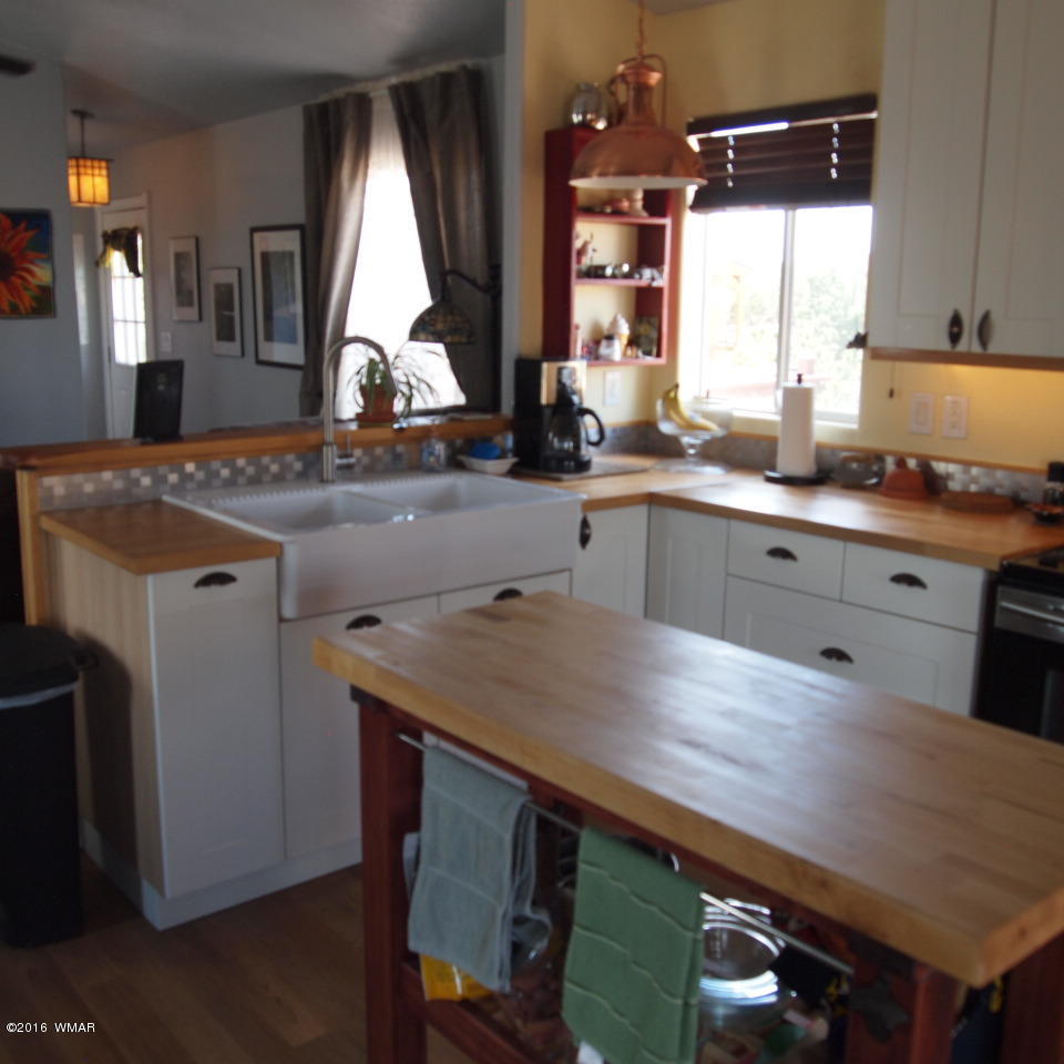 4214 Indian Bend Road Snowflake, AZ 85937 - Photo 11 of 43 a kitchen with a stove a sink and a refrigerator