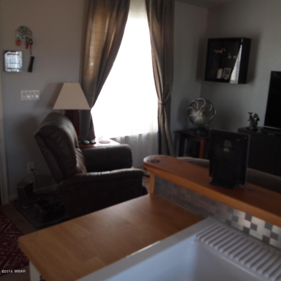 4214 Indian Bend Road Snowflake, AZ 85937 - Photo 14 of 43 a living room with furniture and a window