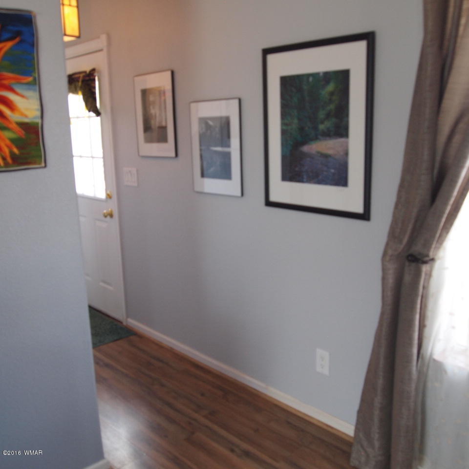 4214 Indian Bend Road Snowflake, AZ 85937 - Photo 16 of 43 a view of a small space with wooden floor and a window