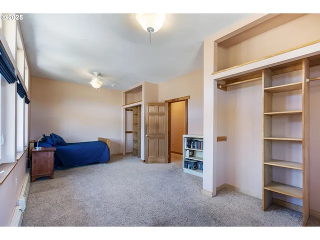 a living room with furniture and a walk in closet