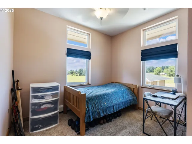 a bedroom with a bed and a table in it