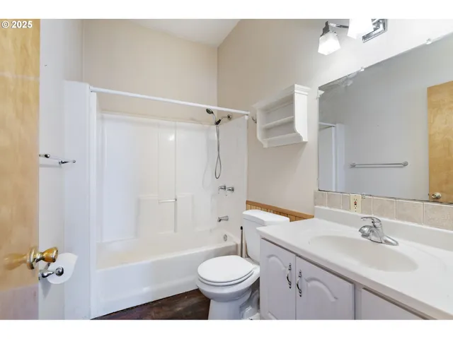 a bathroom with a sink a toilet and a bathtub