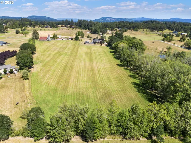 an aerial view of houses with yard