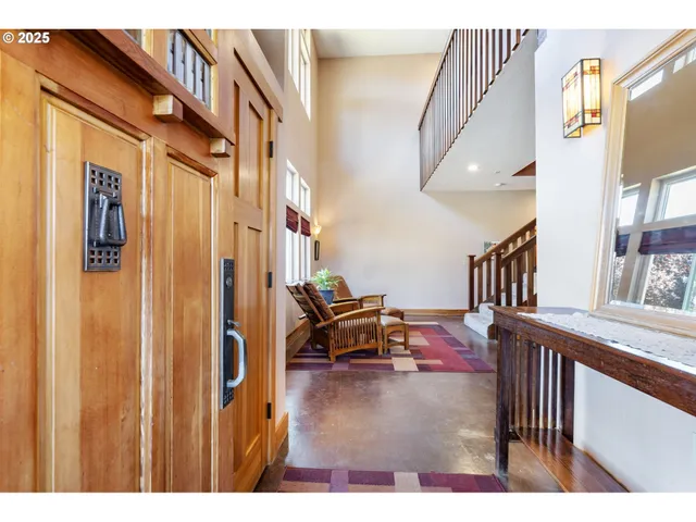 a view of living room kitchen and entryway