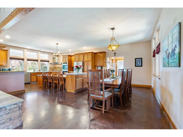 a dining room with furniture window and wooden floor