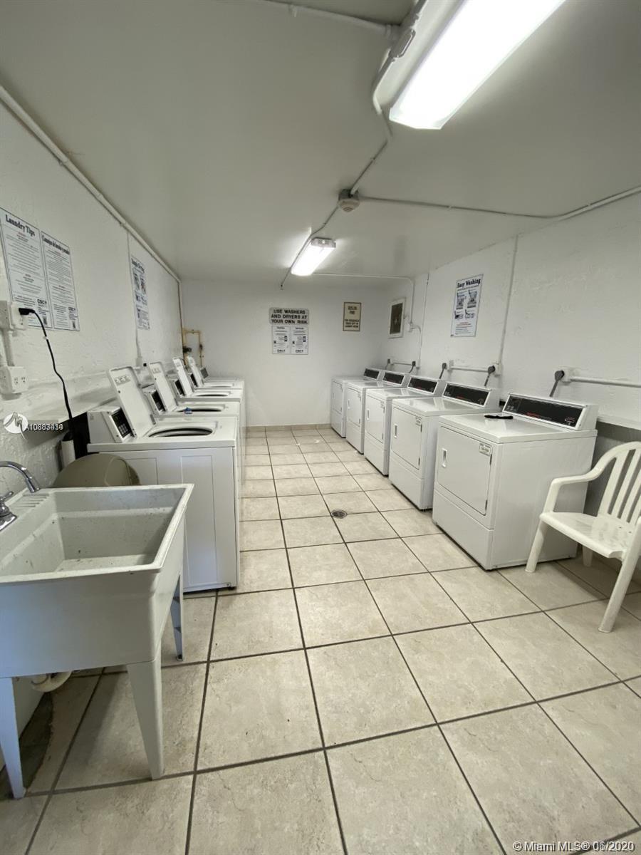 Glenvar Heights Miami, FL 33155 - Photo 3 of 12 a kitchen with a sink a stove and cabinets