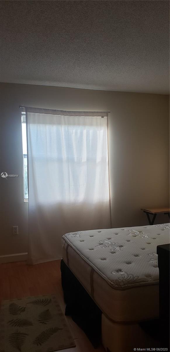 Glenvar Heights Miami, FL 33155 - Photo 10 of 12 a bedroom with a bed and a window