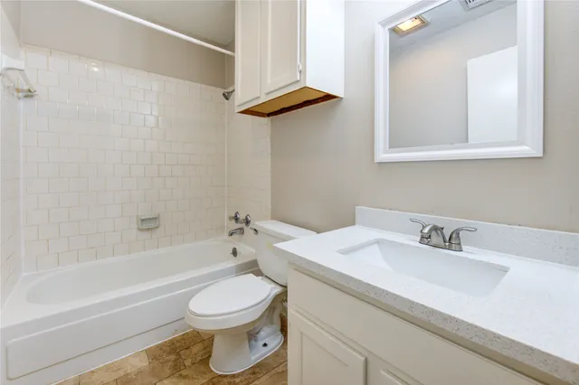 a bathroom with a sink a toilet and a bathtub