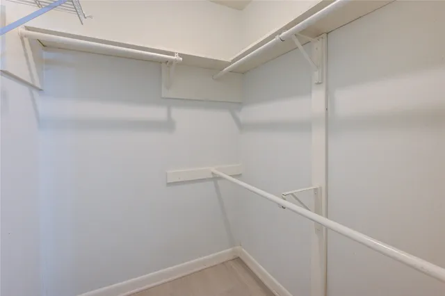 a view of an empty walk in closet