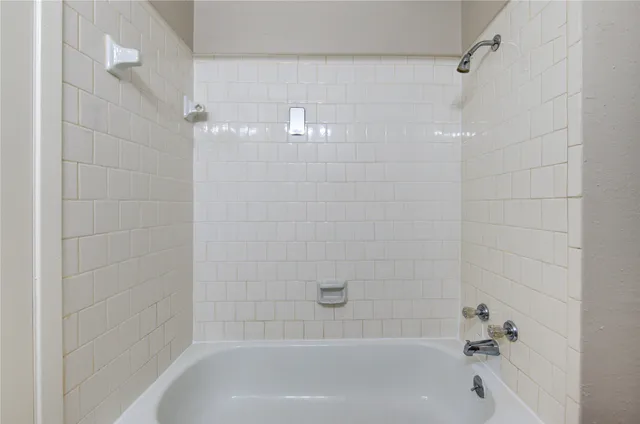 a close up of a bathtub in a bathroom