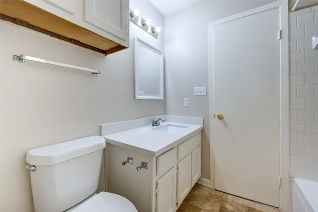a bathroom with a sink and a toilet