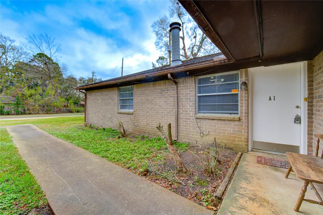 a backyard of a house with lots of green space