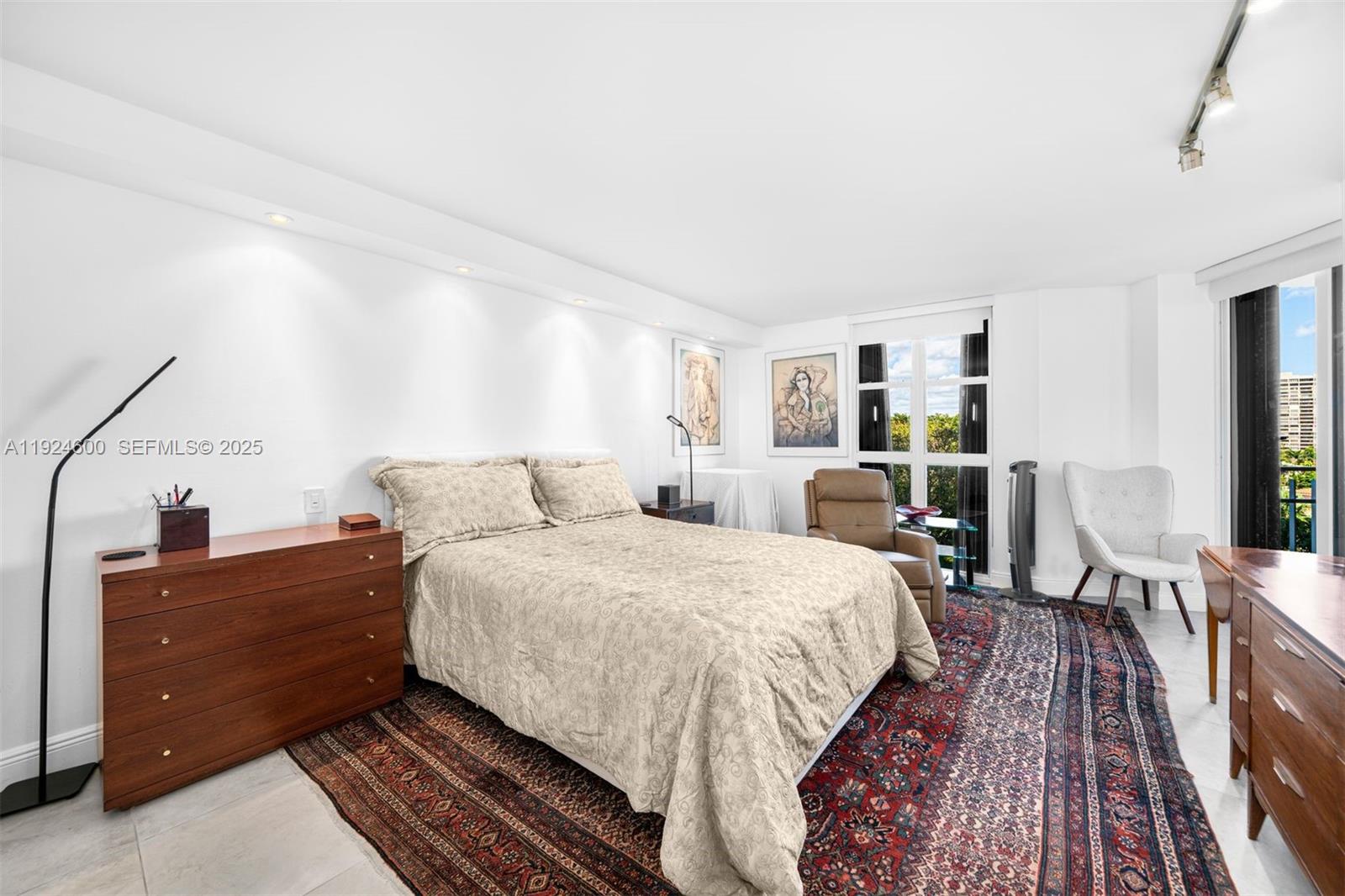 4000 Towerside Terrace, Unit 705 Miami, FL 33138 - Photo 19 of 42 a bed room with a bed and furniture